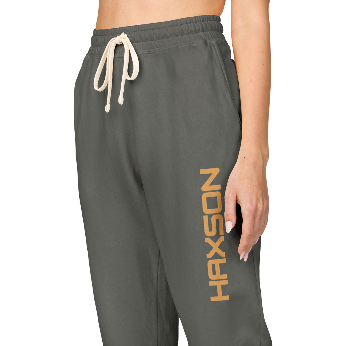 Close-up of gold HAXSON branding on Pepper sweatpants